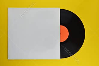 Black vinyl record halfway out of white cover