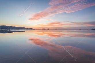 Reflection sunrise or sunset view with orange cloud and blue sky