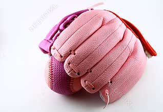 Pink baseball glove and ball