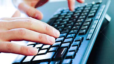Business man typing on a pc keyboard, technology business concept