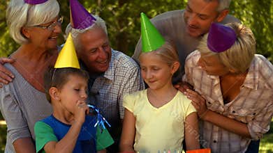 Happy family celebrating a birthday in park