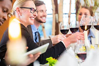 Team at business lunch meeting in restaurant