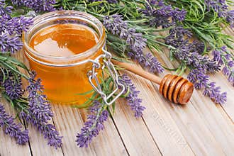 Jar of liquid honey with lavender