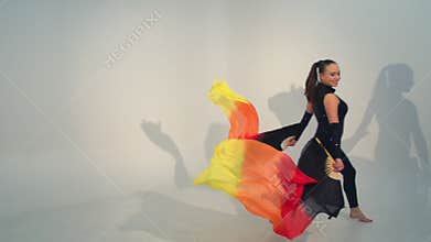 Beautiful young acrobat dance in slow motion