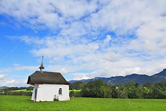 The rural chapel crowned picturesque cross