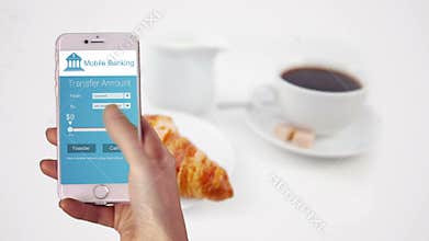 Woman using mobile banking on her phone