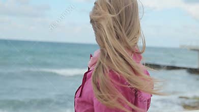 Romantic girl dreaming at sea coast