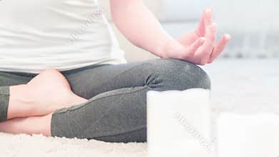 Meditating hand of woman doing yoga