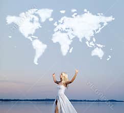 Attractive lady over the cloud world map