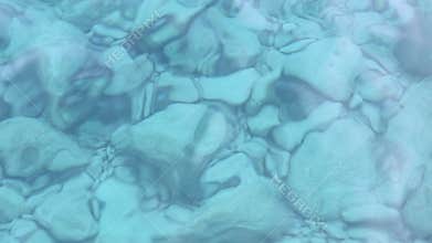 Rocks under crystal clear water