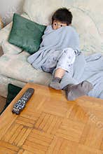 Boy watching a horror movie