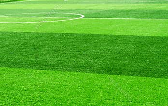 White stripe on artificial green grass of soccer field