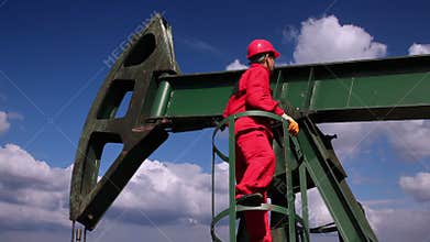Oil Worker and Pump Jack Drilling Rig