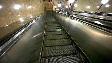 Escalator carries commuters down to the metro