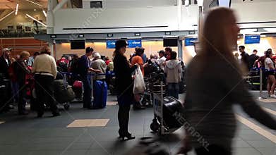 Passangers long line up for waiting check in counter at YVR airport