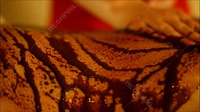 The spa tratment with scrub with coffee and chocolate on the body parts