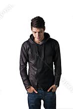 Handsome shy young man in black hoodie sweater standing