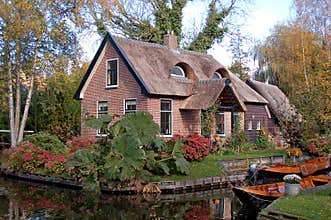 Thatched house and boats