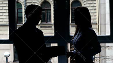 Girl shows document to a colleague on plate