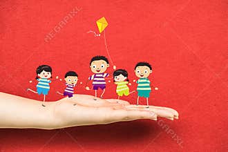 Little children kites on a hand