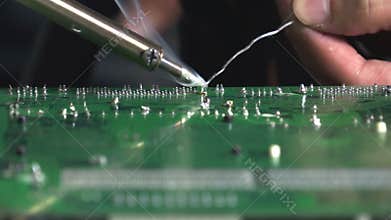 Repairing solder weld, fuse together by heating a lead to melt at the back of motherboard
