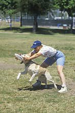Dog and man practicing at Canine Frisbee Contest, Westwood, Los Angeles, CA