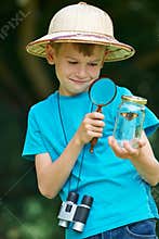 Boy Studying Butterfly Caught In Jar