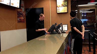 People ordering food at burger king check out counter