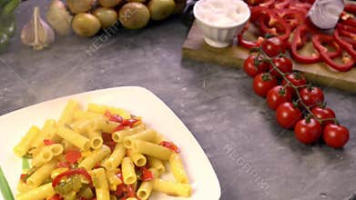 serving pasta with peppers on the plate