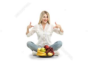 Happy young woman and healthy vegetarian food, fruit. Concept of