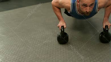 Fit man exercising with kettlebell