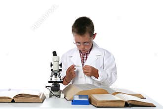 Child scientist looking at microscope slide