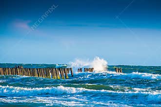 Waves and wooden pier