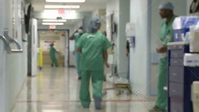 Hospital staff moving through hallway (2 of 3)
