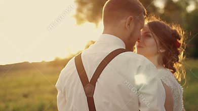 Young beautiful couple bride and groom embracing