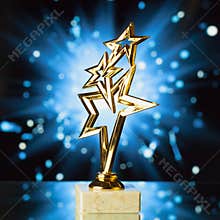 Gold stars trophy against blue shiny background