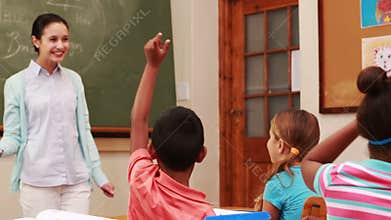 Pupils raising their hands during class