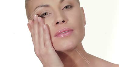 Young woman apply the cream for the face