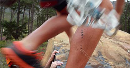 Smiling couple rock climbing