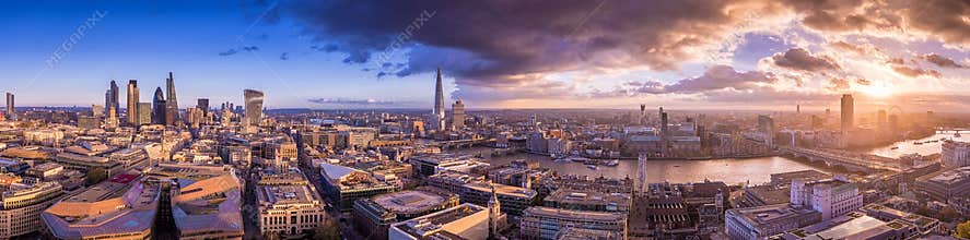 Panoramic skyline of south and east part of London with beautiful dramatic clouds and sunset - UK
