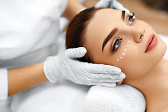 Skin Care. Cosmetic Cream On Woman's Face. Beauty Spa Treatment