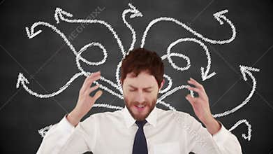 Stressed businessman with hands on head