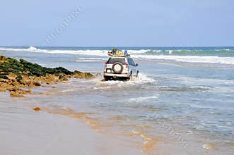 Adventurous Driving Along the Beach