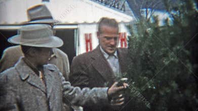 CLEVELAND, OHIO 1953: Dad shows off this years Christmas tree with family.