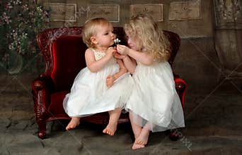 Sisters Smelling Flower