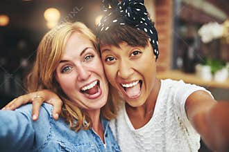 Exuberant happy multi ethnic girl friends