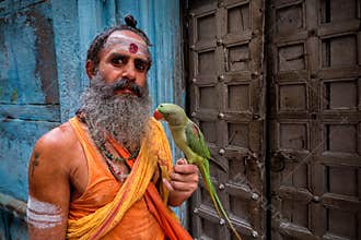 Man with parrot, Varanasi, India