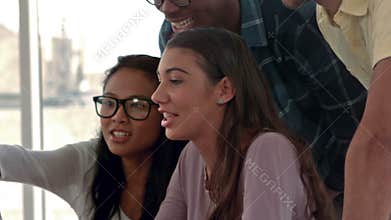 Casual business people working on computer