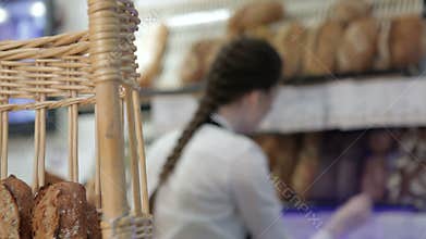 Girl baker put price labels on bread