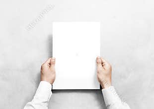 Hand holding white blank paper sheet mockup, .